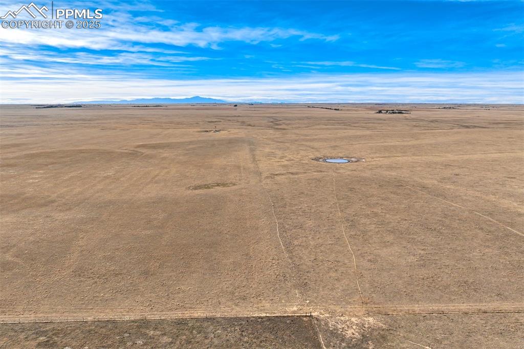 Image 9 of 30: Overview of rural landscape with a desert landscape and a mountainous backg
