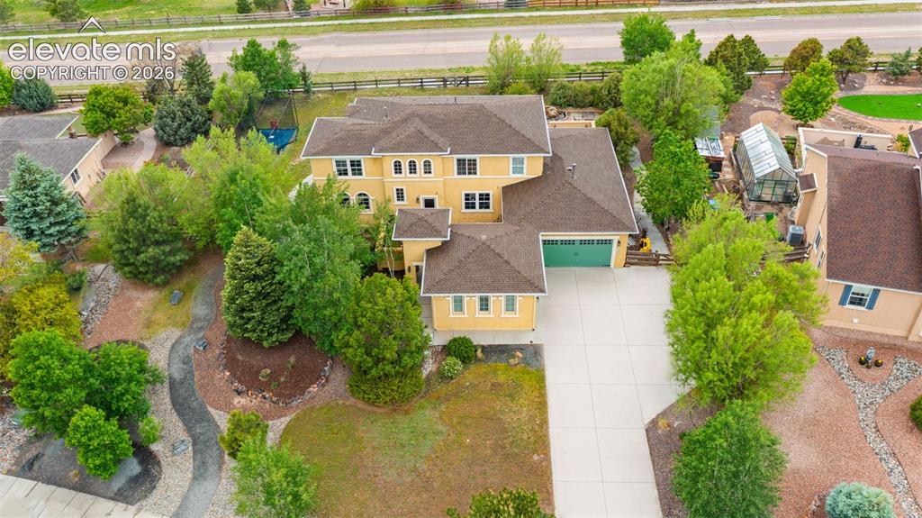 Image 31 of 45: Expansive property featuring a multi-level residence with a three-car garag