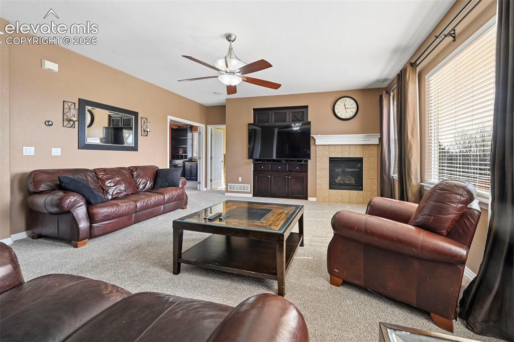 Image 4 of 45: Living room featuring a ceiling fan, recessed lighting, and carpet flooring