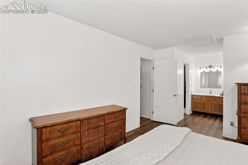 Image 15 of 25: Bedroom 2 w/ private vanity