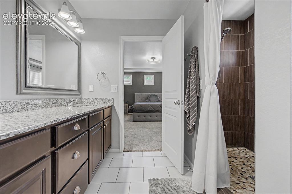 Image 19 of 40: Tile Flooring and Large Walk-in Shower!