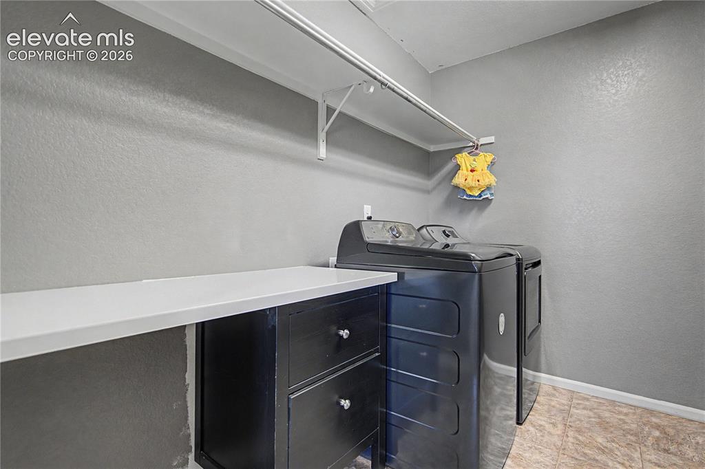 Image 21 of 40: Laundry w/Built-in Folding Counter!