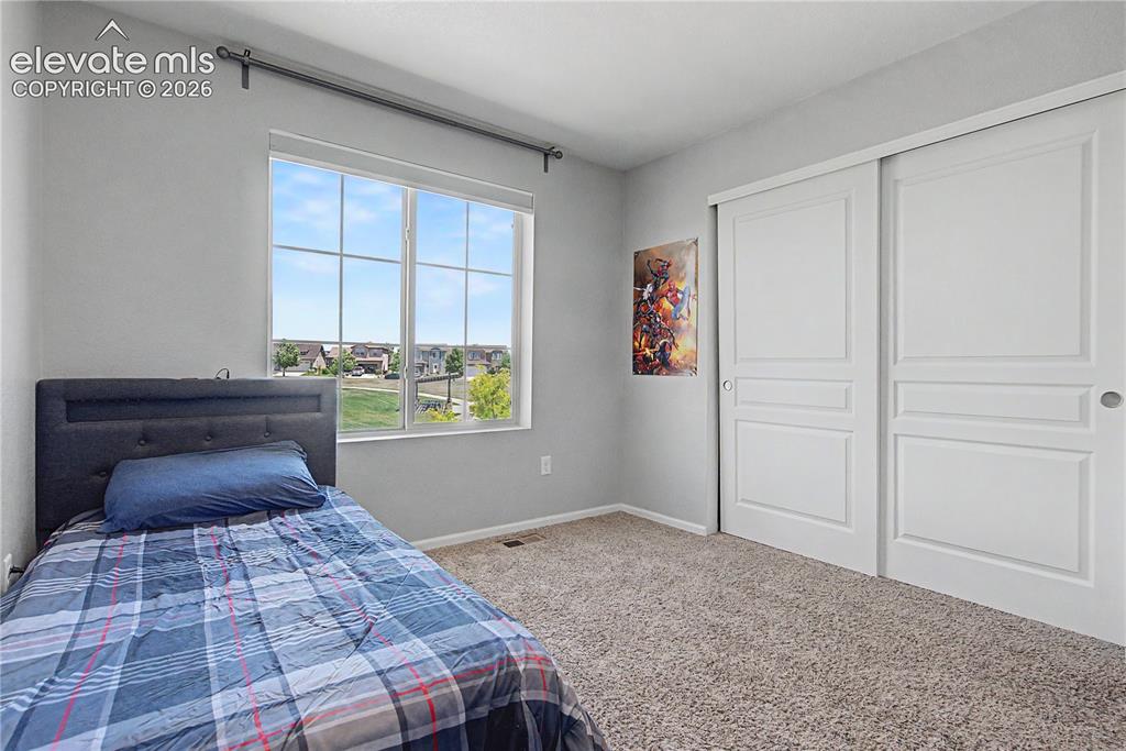 Image 23 of 40: 3rd Bedroom Upstairs w/View of Park