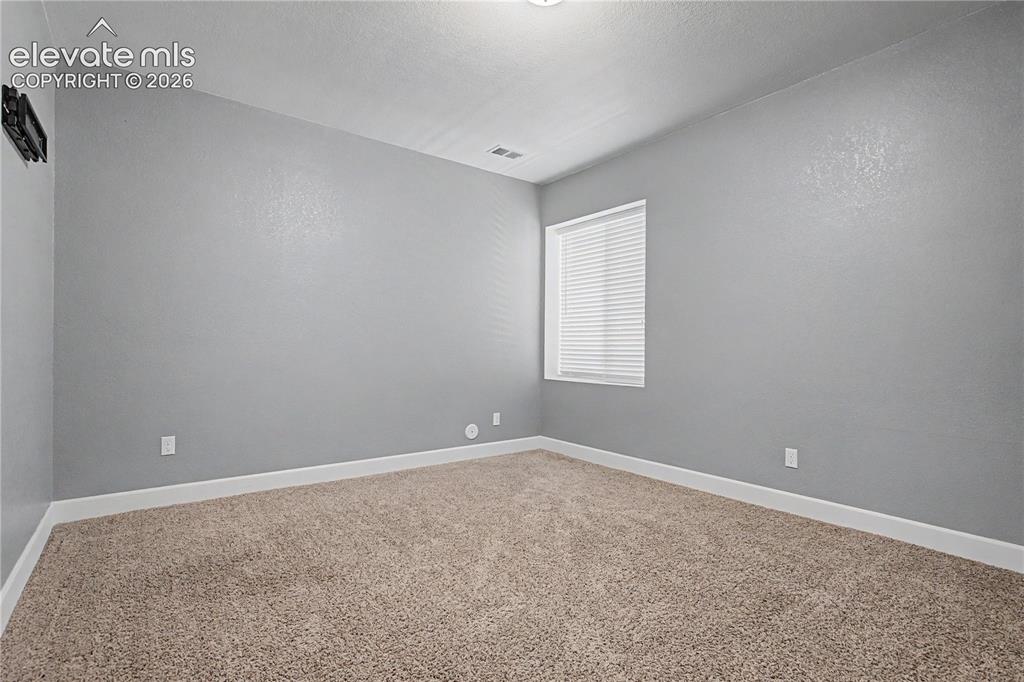 Image 30 of 40: Basement Bedroom
