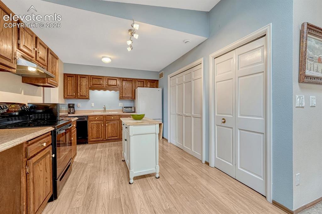 Image 11 of 48: Kitchen connects to dining room and features a large pantry and free-standi