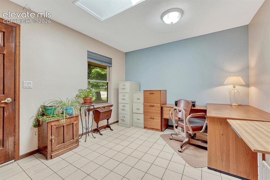 Image 17 of 48: Third bedroom currently serves as an office, which it’s well suited for wit