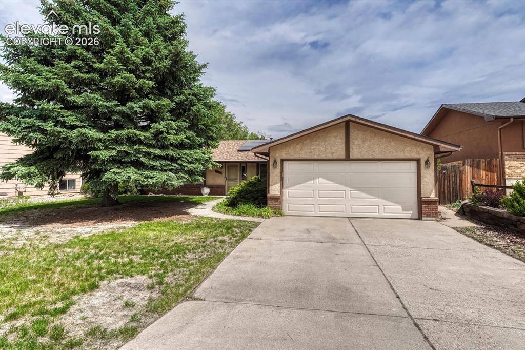 Image 5 of 48: If you’re looking for three bedrooms, two bathrooms, and an attached two-ca
