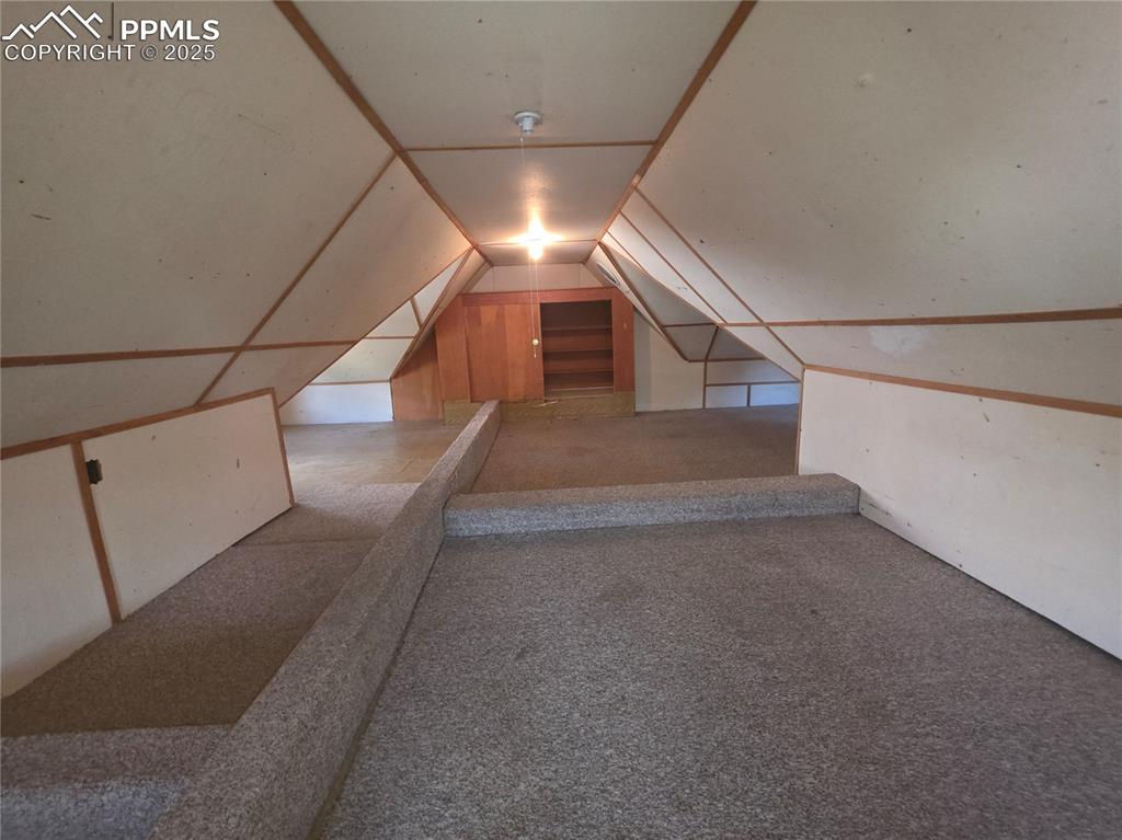 Image 22 of 37: UPPER LEVEL - BEDROOM, OFFICE, LIVING SPACE, STORAGE