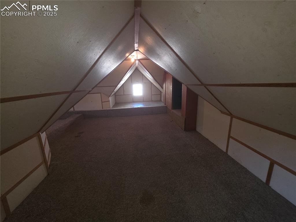 Image 23 of 37: UPPER LEVEL - BEDROOM, OFFICE, LIVING SPACE, STORAGE