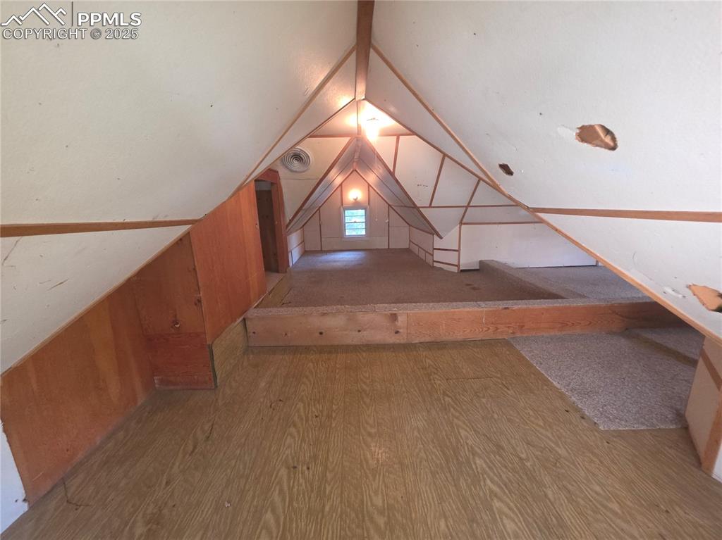 Image 24 of 37: UPPER LEVEL - BEDROOM, OFFICE, LIVING SPACE, STORAGE