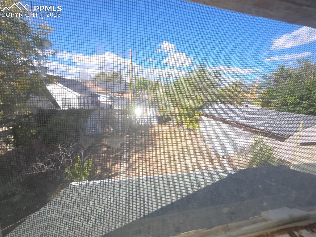 Image 26 of 37: FROM UPPER LEVEL into Backyard