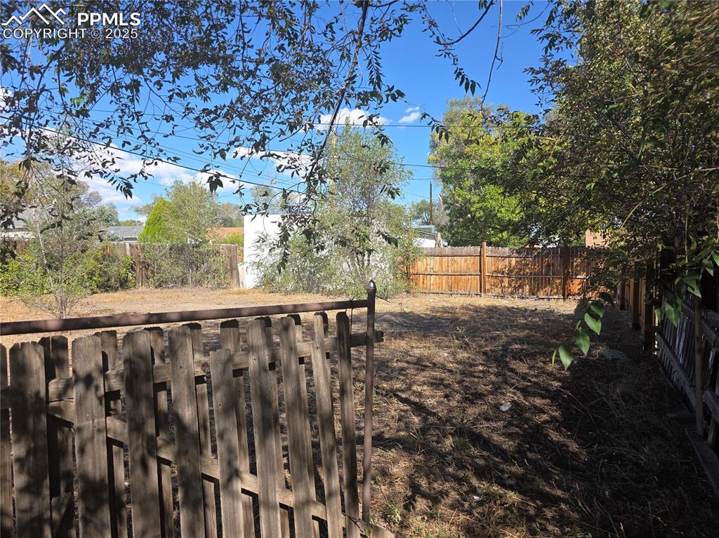 Image 32 of 37: follow the sidewalk from back door, this lot is also backyard, it is off se