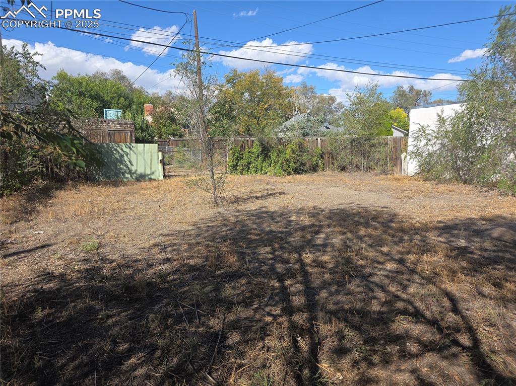 Image 33 of 37: follow the sidewalk from back door, this lot is also backyard, it is off se