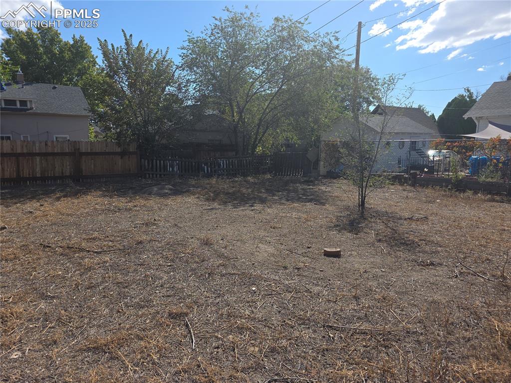 Image 34 of 37: follow the sidewalk from back door, this lot is also backyard, it is off se