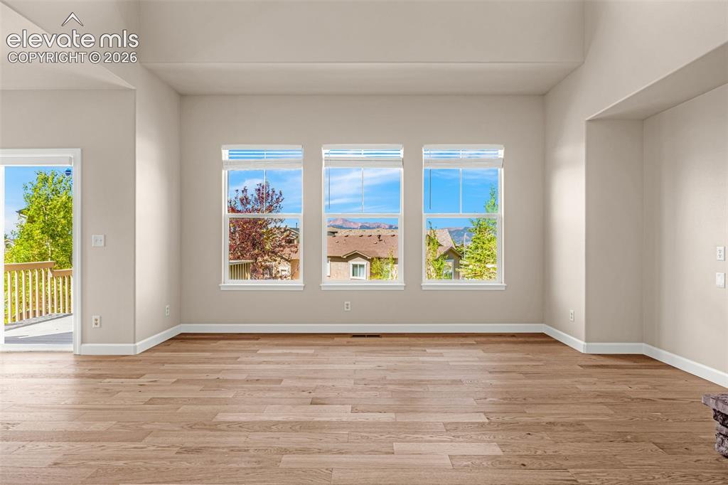 Image 11 of 42: Another view from the Great Room framing the stunning Pikes Peak and front
