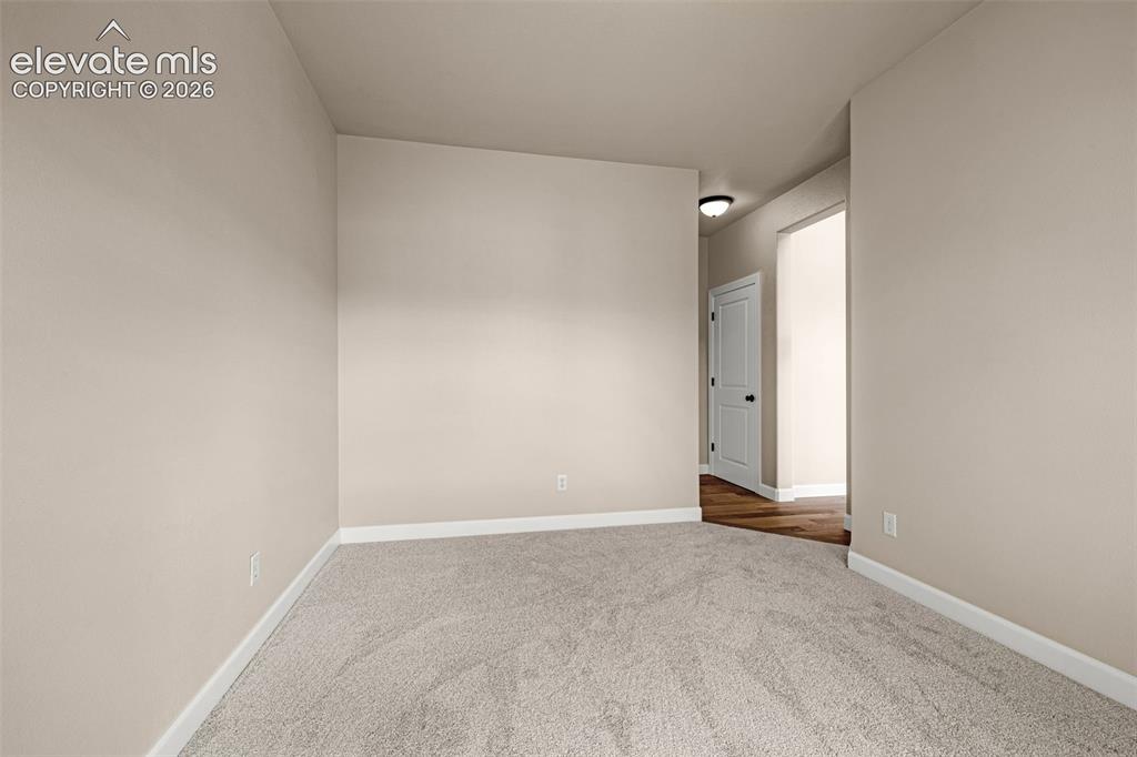 Image 12 of 42: Office is located off the Great Room and offers privacy and steps away to t