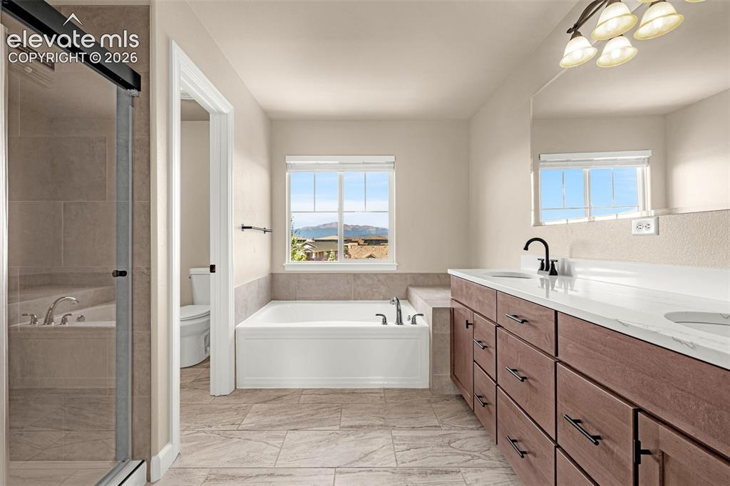 Image 20 of 42: Primary Bathroom has all new flooring, stand alone shower, new cabinets wit