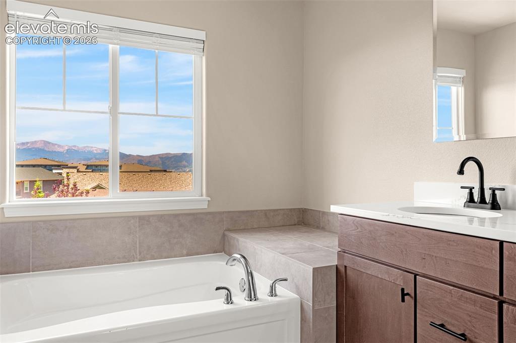 Image 21 of 42: Wake up to the sun-kissed mountains or relax the day away in the oversized