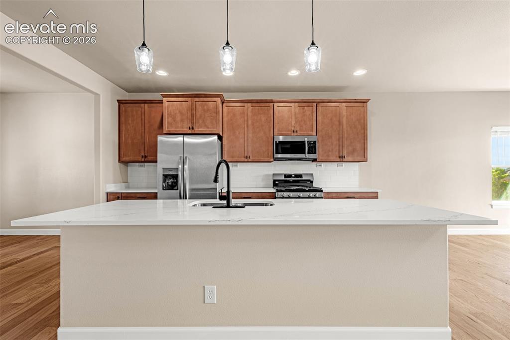 Image 3 of 42: Large island with storage and additional seating.