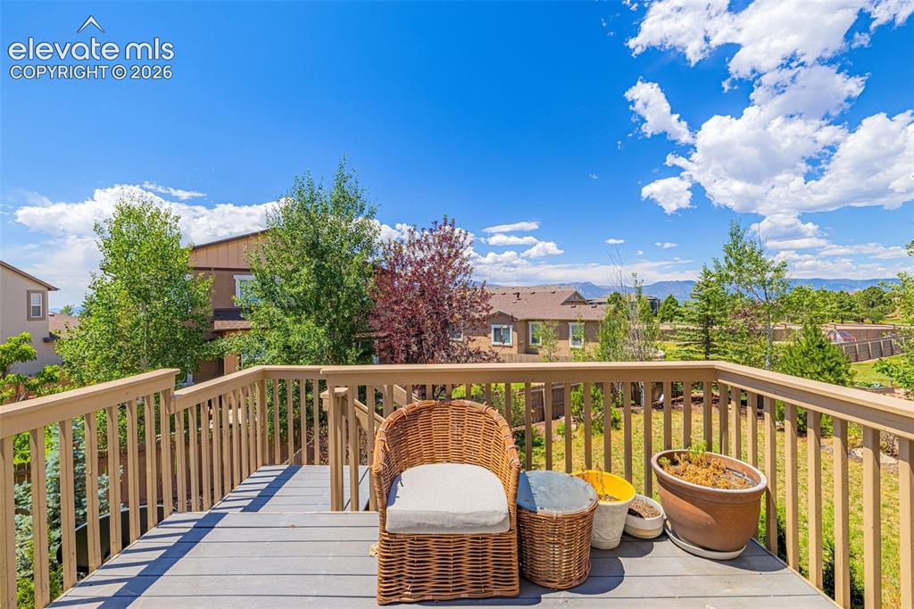 Image 33 of 42: Deck is spacious for a seating area to enjoy the Summer heat and watch the