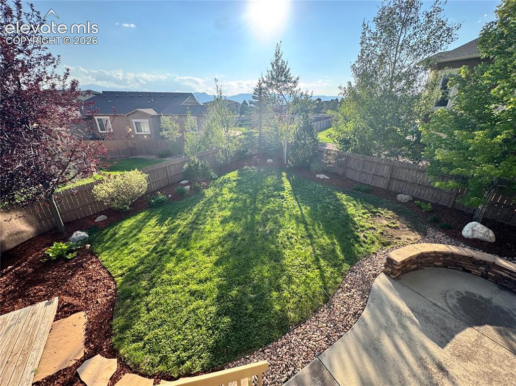 Image 35 of 42: Trees add privacy without blocking the view of the mountains. Expanded pati