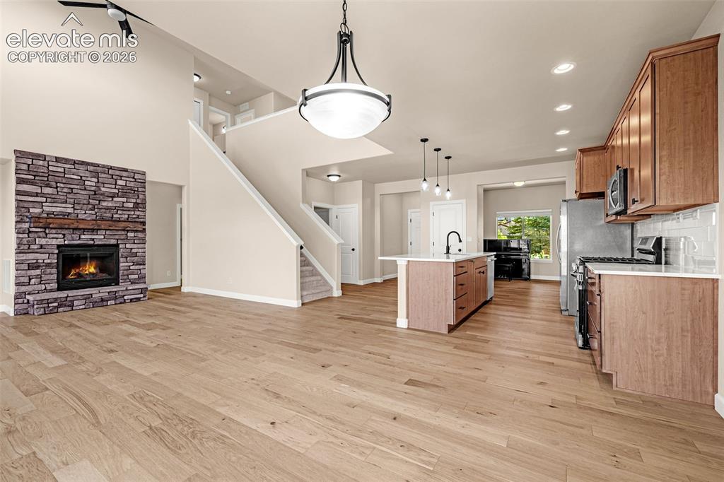 Image 8 of 42: Walk-out breakfast area has ample room for a large table and is open to the