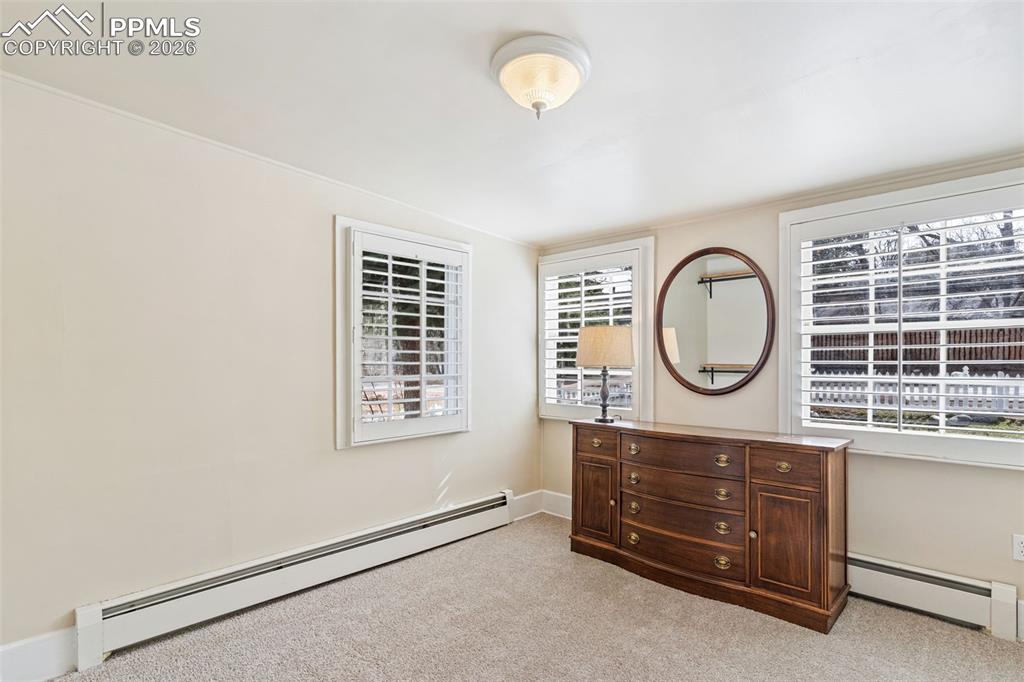 Image 20 of 36: Office/sitting/dressing room off the primary bedroom. Light and bright with