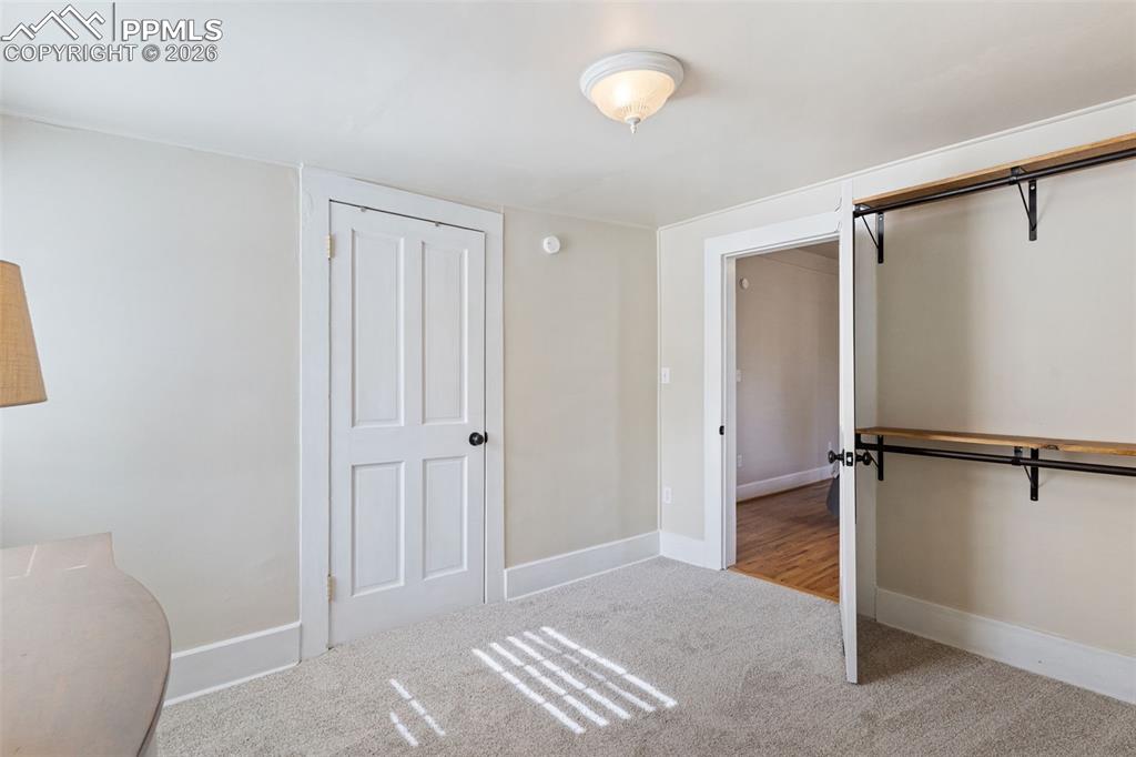 Image 21 of 36: Office/sitting/dressing room off the primary bedroom. Light and bright with