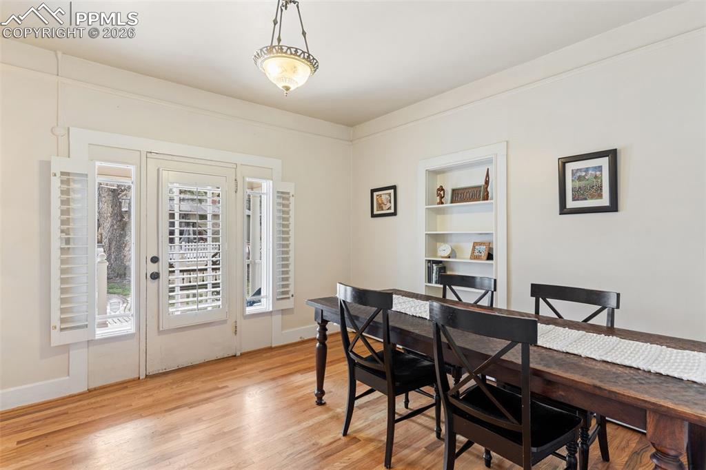 Image 8 of 36: Beautiful entry way also serves as a lovely dining room with beautiful hard