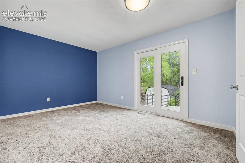 Image 12 of 44: Primary bedroom has access to full bathroom and it