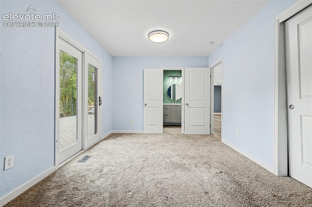 Image 13 of 44: Primary bedroom has access to full bathroom and it