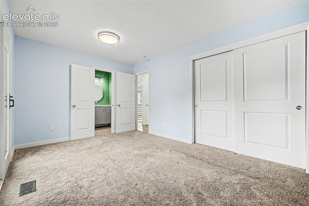 Image 14 of 44: Primary bedroom has access to full bathroom and it