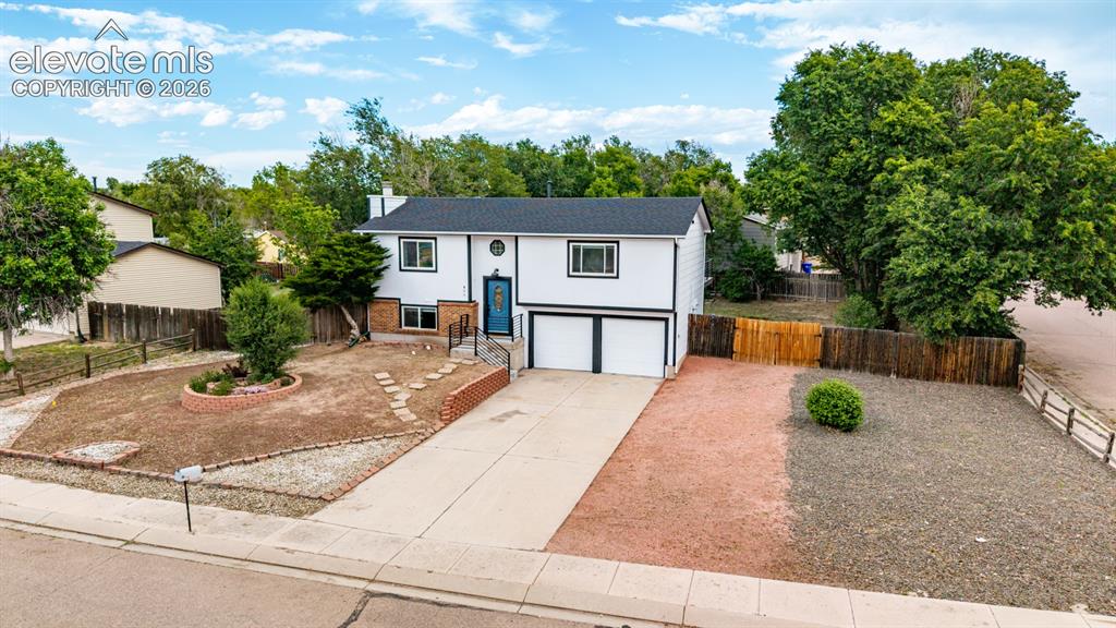 Image 42 of 44: Bi-level home on oversized corner lot featuring space for RV/trailer parkin