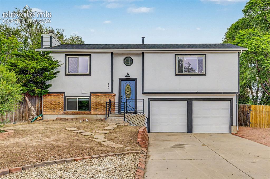 Image 43 of 44: Bi-level home featuring a two car garage with new garage doors coming soon 