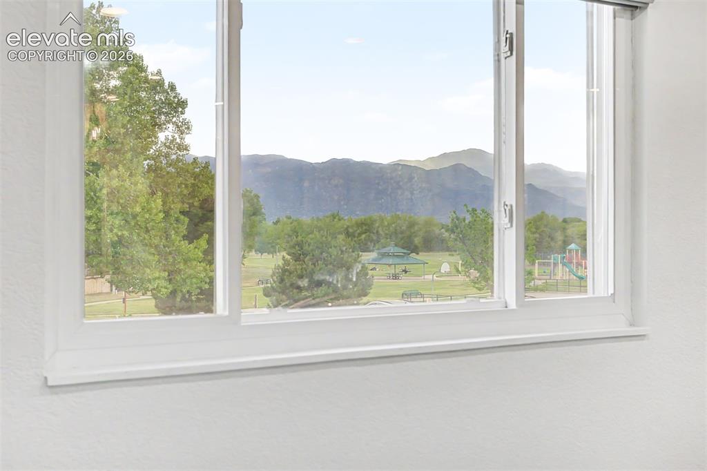 Image 6 of 44: Enjoy Pikes Peak view from your living room. 