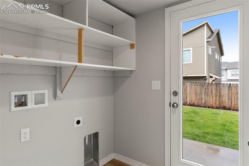 Image 5 of 22: Laundry room featuring electric dryer hookup, hookup for a washing machine,