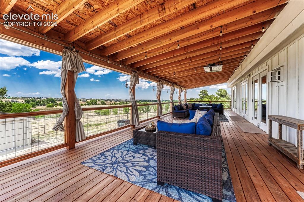 Image 34 of 50: Covered back deck