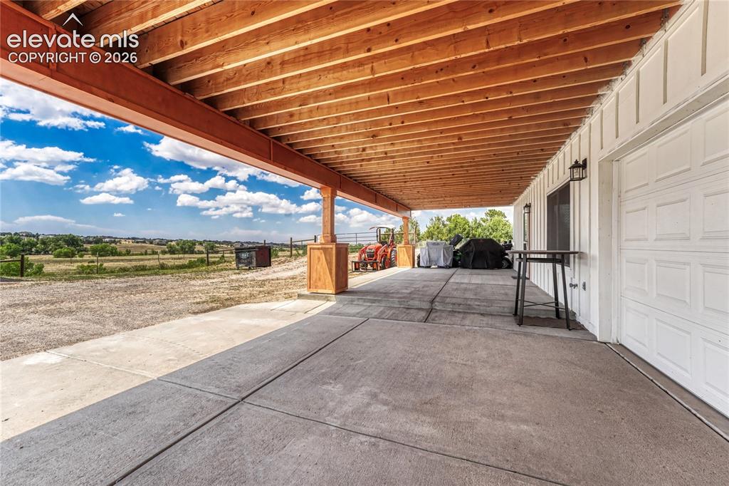 Image 36 of 50: Covered patio/walk out basement