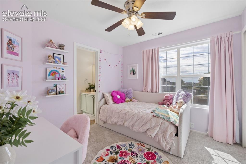Image 18 of 43: Upstairs bedroom with adjoining bath