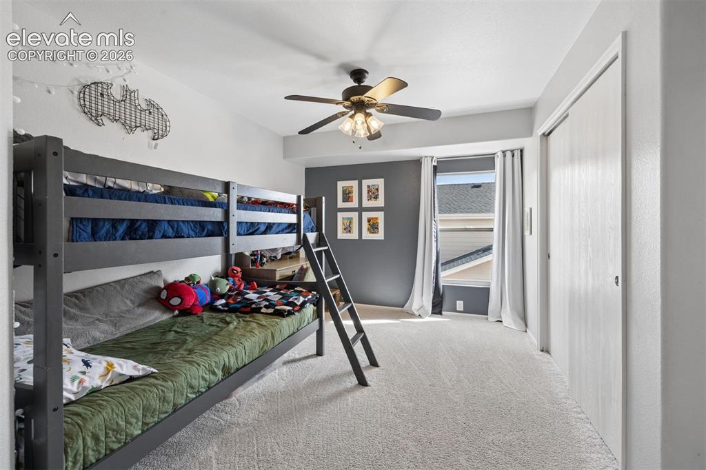 Image 20 of 43: Upstairs bedroom with adjoining bath