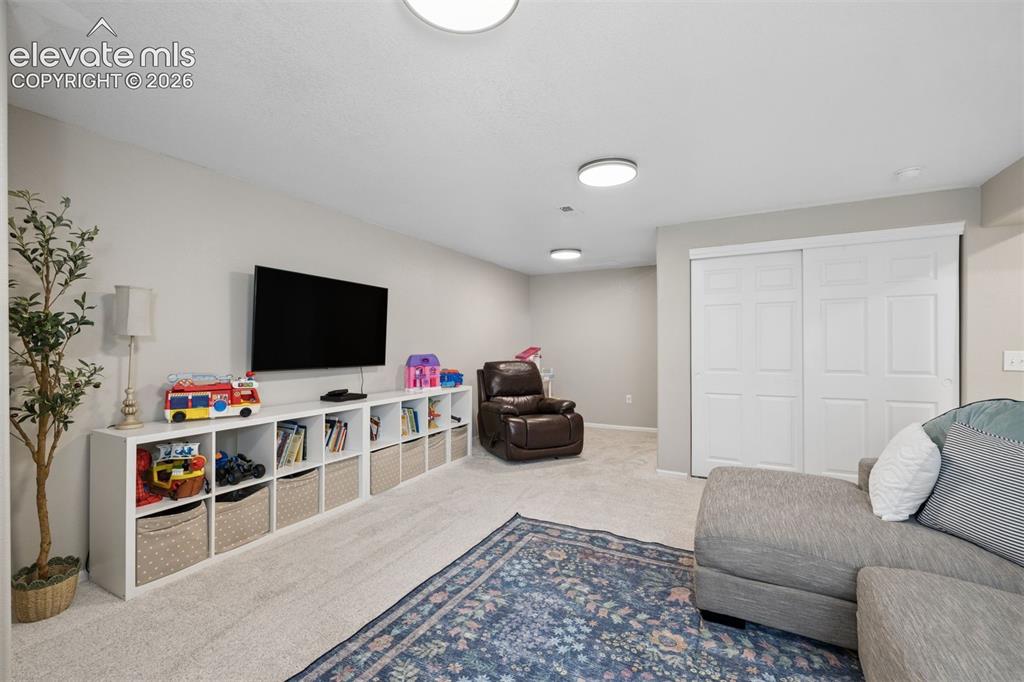 Image 25 of 43: Large basement family room, great for entertaining!