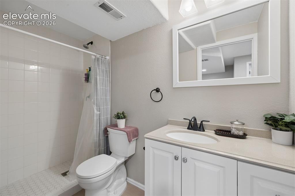 Image 27 of 43: Ensuite 3/4 bath with tile mud set pan