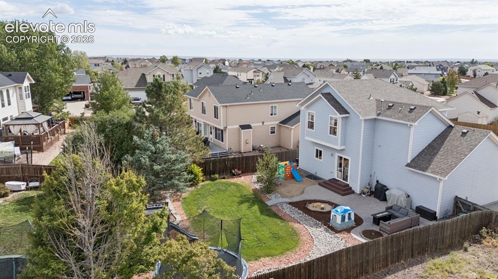 Image 43 of 43: Backyard with thoughtful landscaping