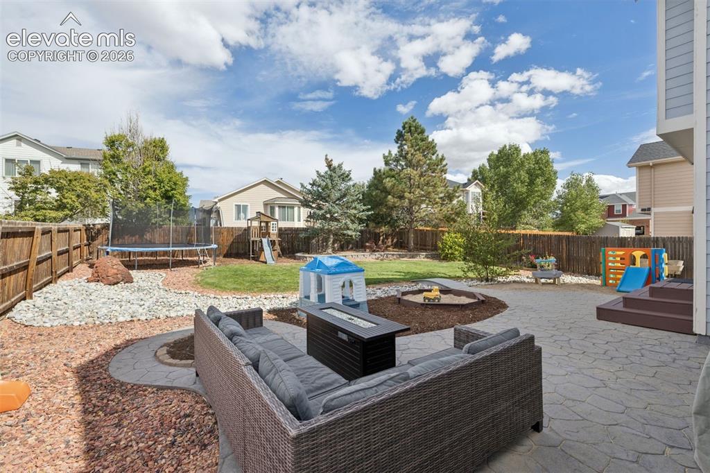 Image 6 of 43: Beautifully landscaped backyard