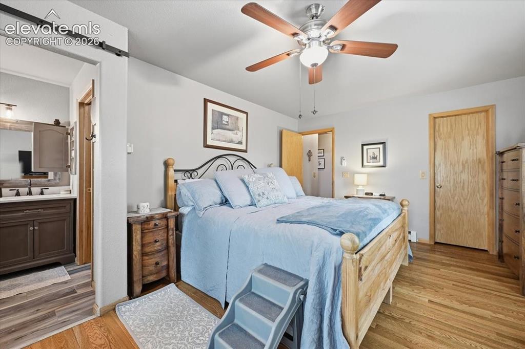 Image 15 of 44: Main level primary room with en suite