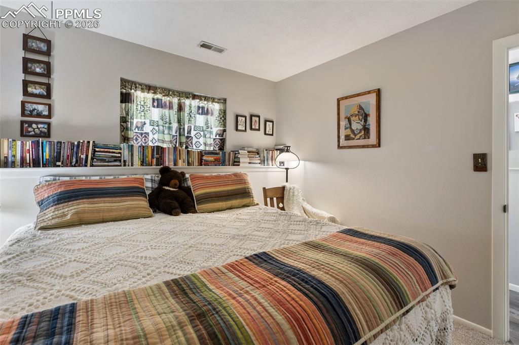 Image 18 of 36: Bedroom with carpet