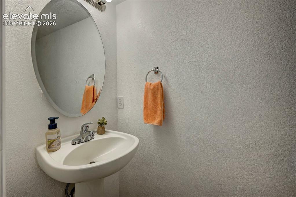 Image 12 of 28: Main level powder room
