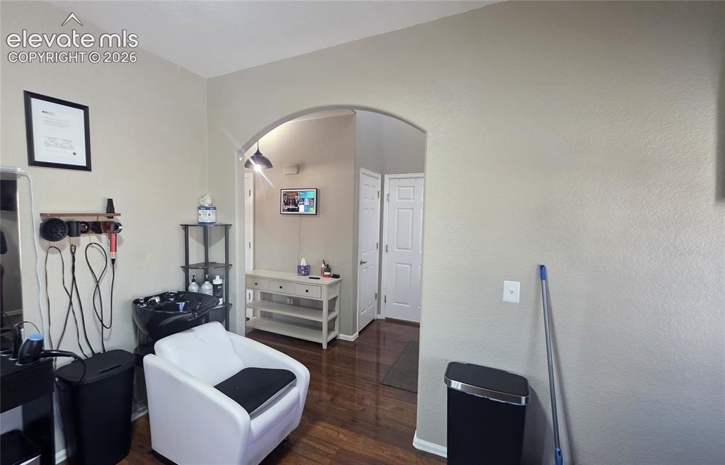 Image 6 of 35: Hardwood-finish flooring throughout, complemented by light-toned wall finis