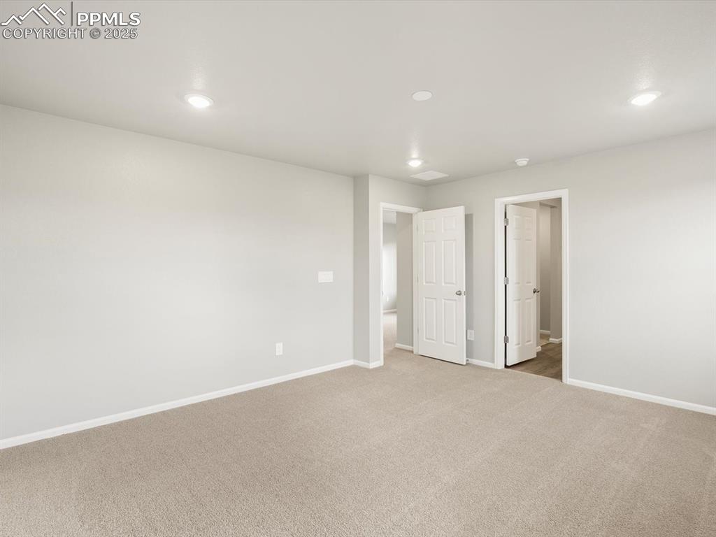 Image 17 of 25: Unfurnished bedroom with recessed lighting and carpet