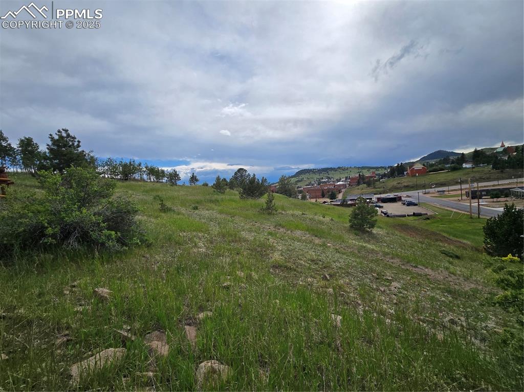 Image 8 of 10: View of mountain backdrop with rural landscape